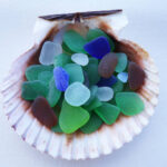 Naturally created sea glass in multiple colors, close up, simple settings