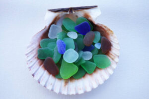 Naturally created sea glass in multiple colors, close up, simple settings