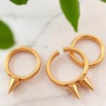 Gold horseshoe nipple rings